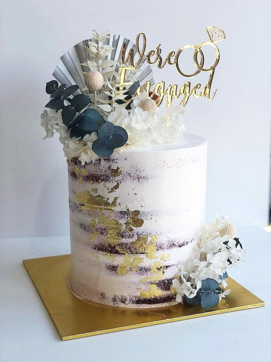 We're Engaged Cake Topper with rings